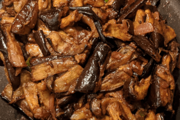 Deep fried eggplant slices on a pan