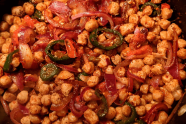 Soya chunks fried with pieces of onion and chilies on a pan