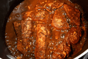 Spicy sri lankan fish curry in a pan