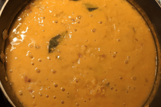 red lentil curry with coconut milk in a pan