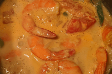 shrimps cooked in a red coconut curry with spices and green chilies