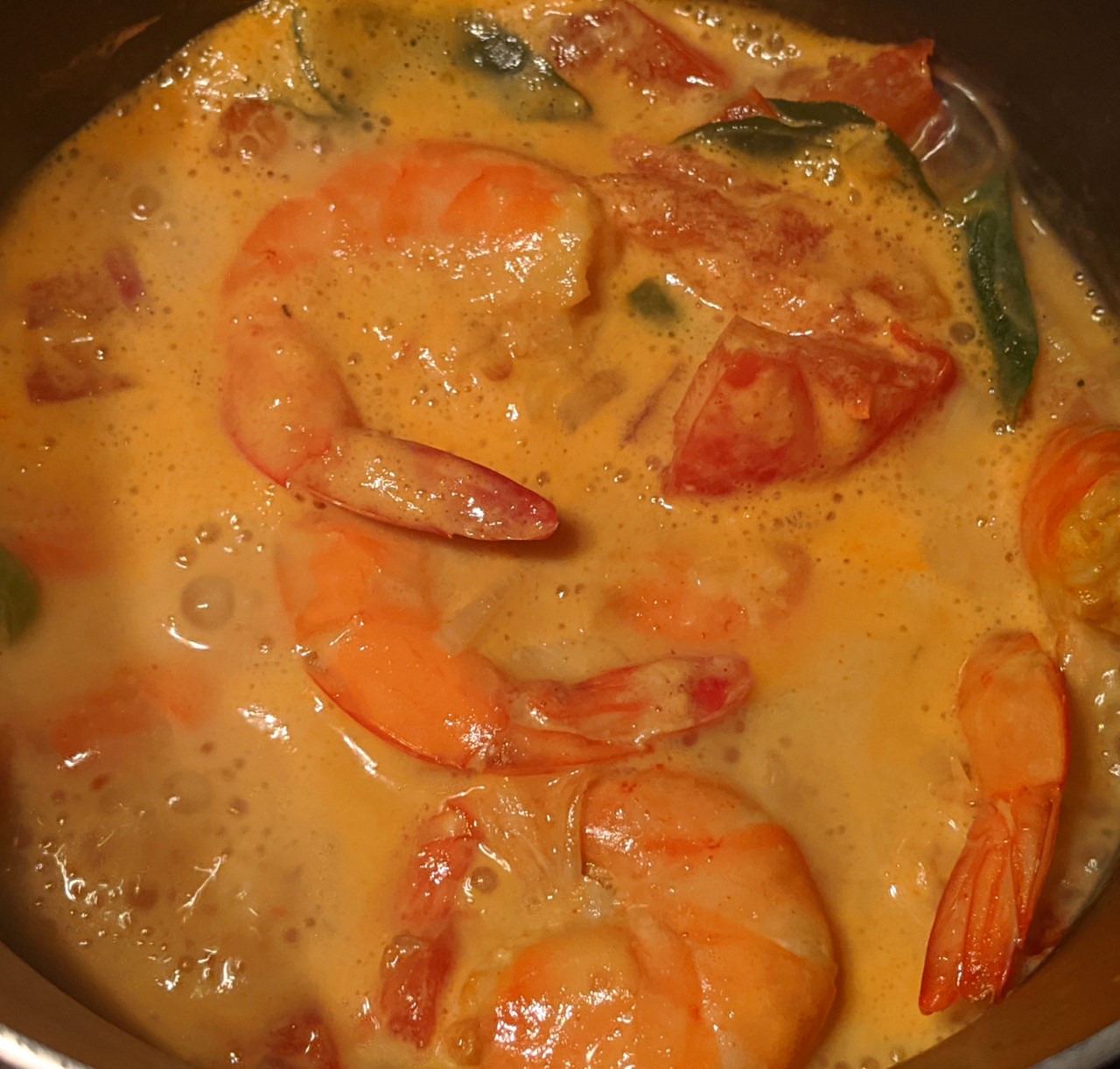 curried prawns in coconut milk in a pan
