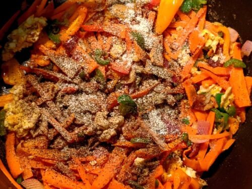 Fried vegetables and egg mixture with seasonings