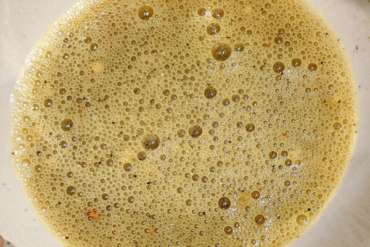 Beaten egg with spices in a bowl