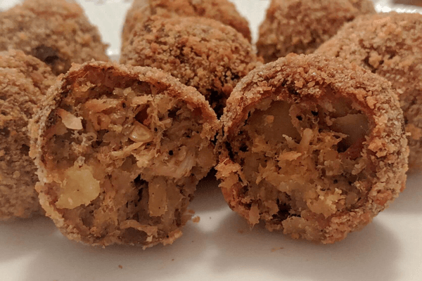 Fried cutlets cut in half with a filling of fish and potatoes inside