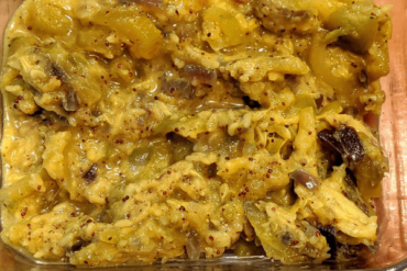 Zucchini curry cooked with spices on a glass dish