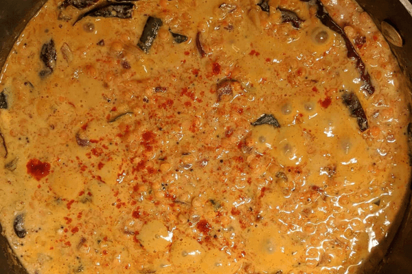 red lentil curry with coconut milk in a pan
