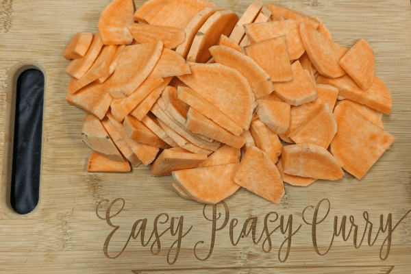 Chopped sweet potatoes on a cutting board